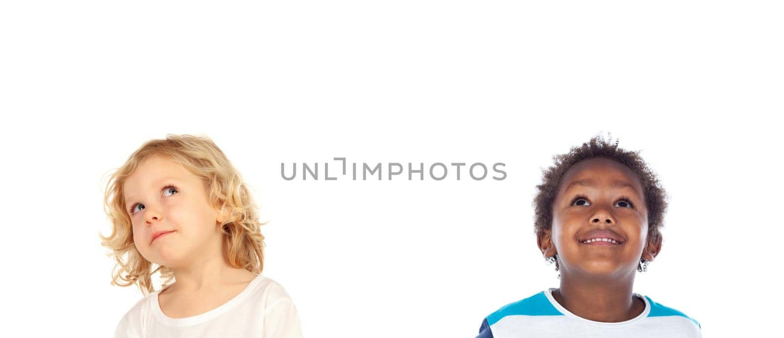 Two funny children looking up isolated on a white background