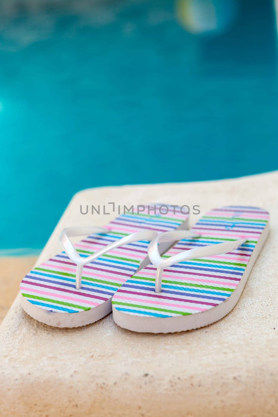 Color flip-flops near to the pool