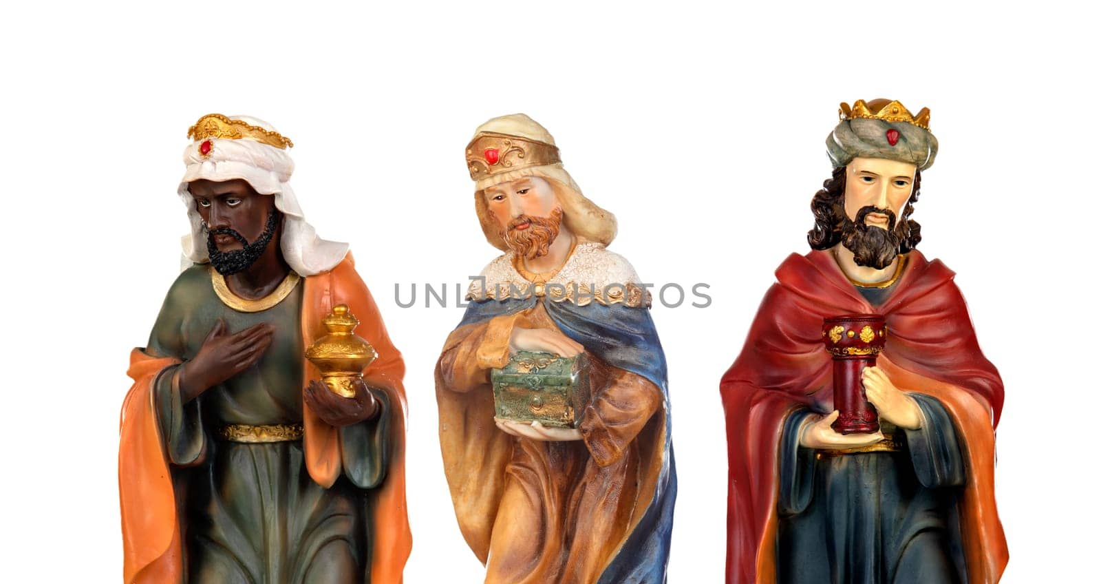 The three wise men. Ceramic figures isolated on white background
