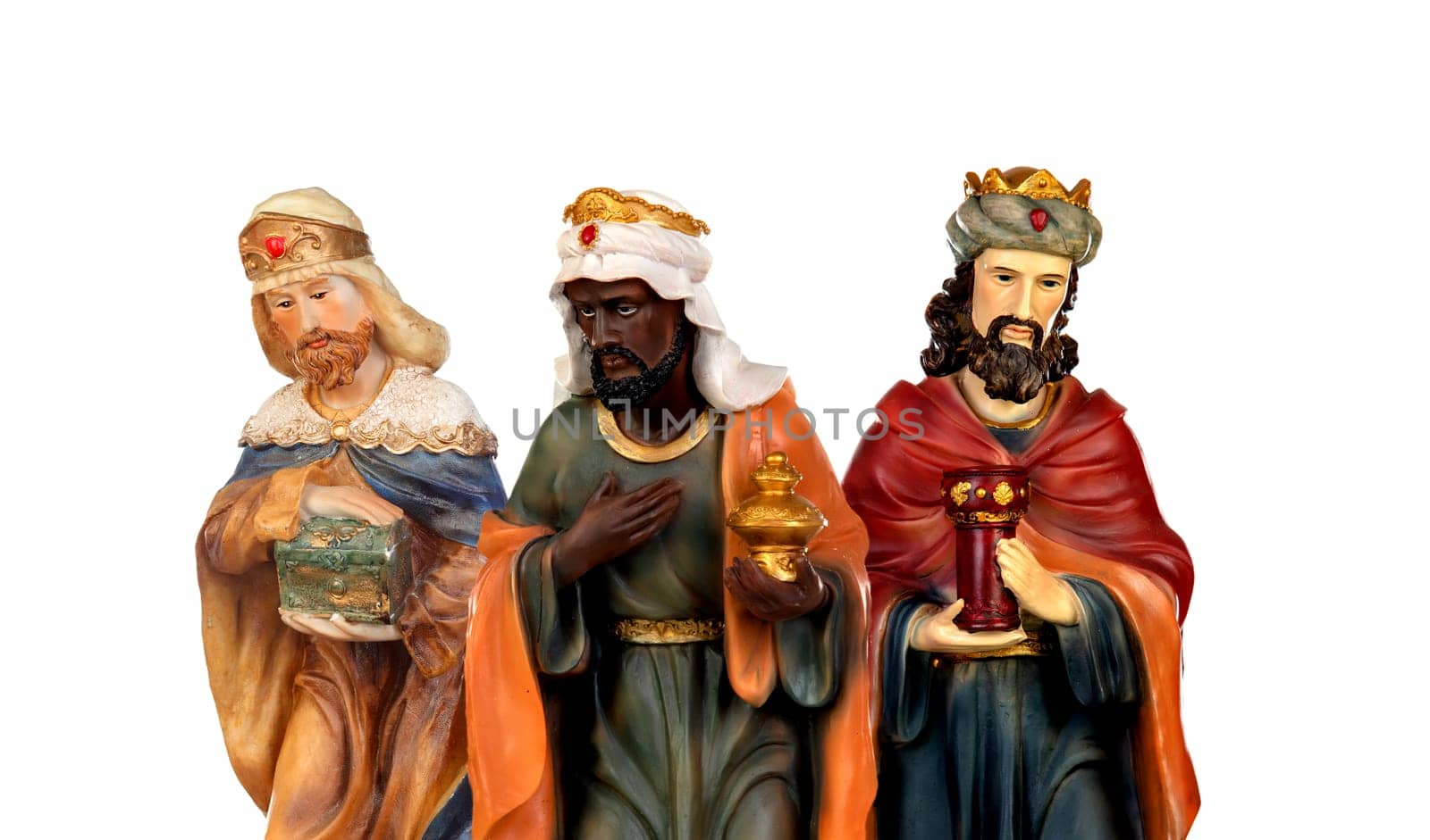 The three wise men. Ceramic figures isolated on white background