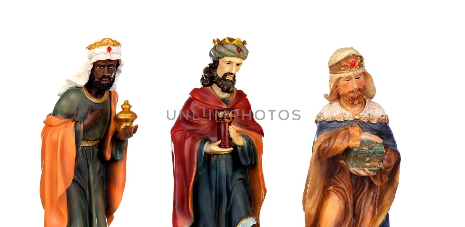 The three wise men. Ceramic figures isolated on white background