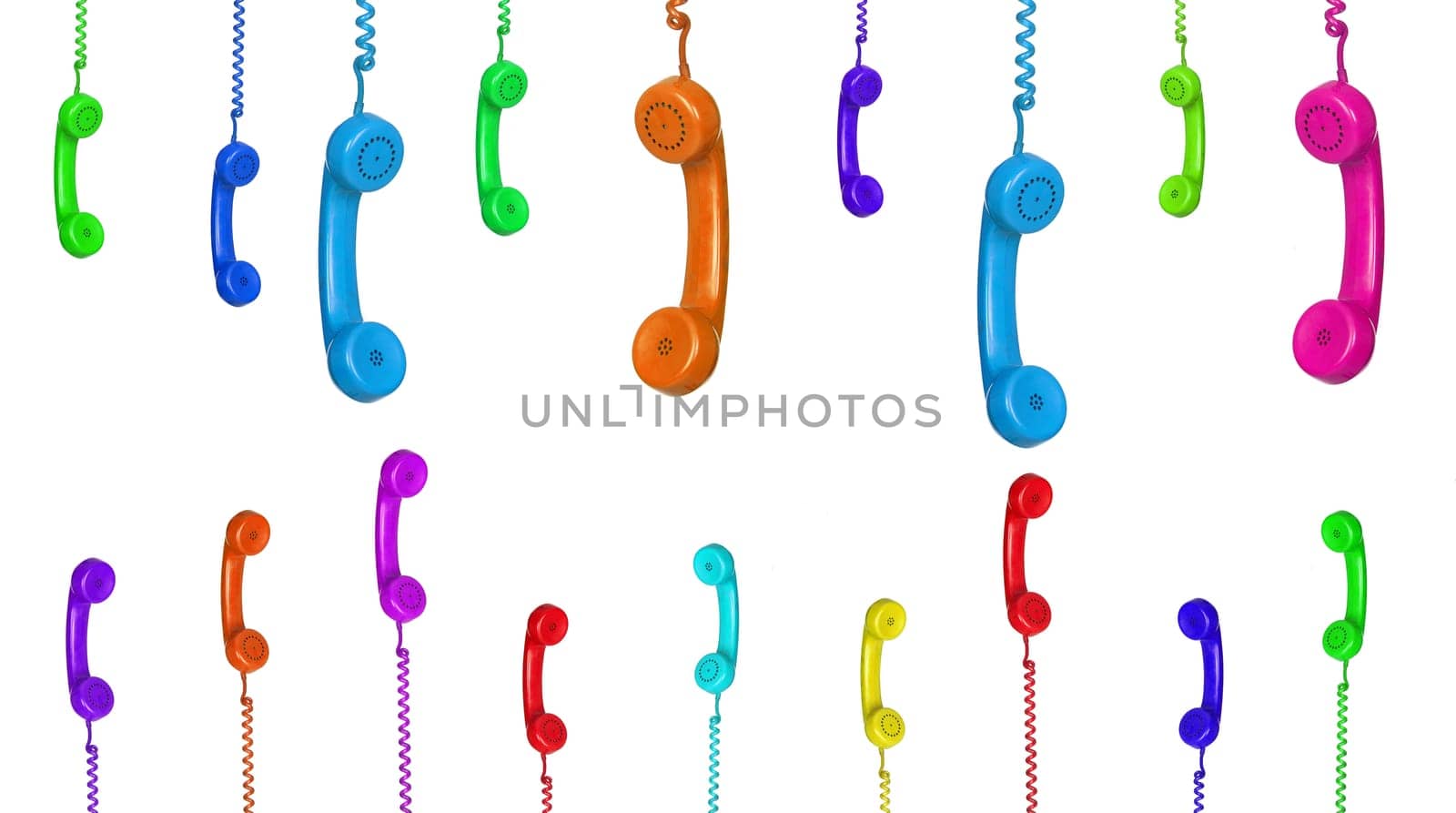 Row of old handsets hanging on white background
