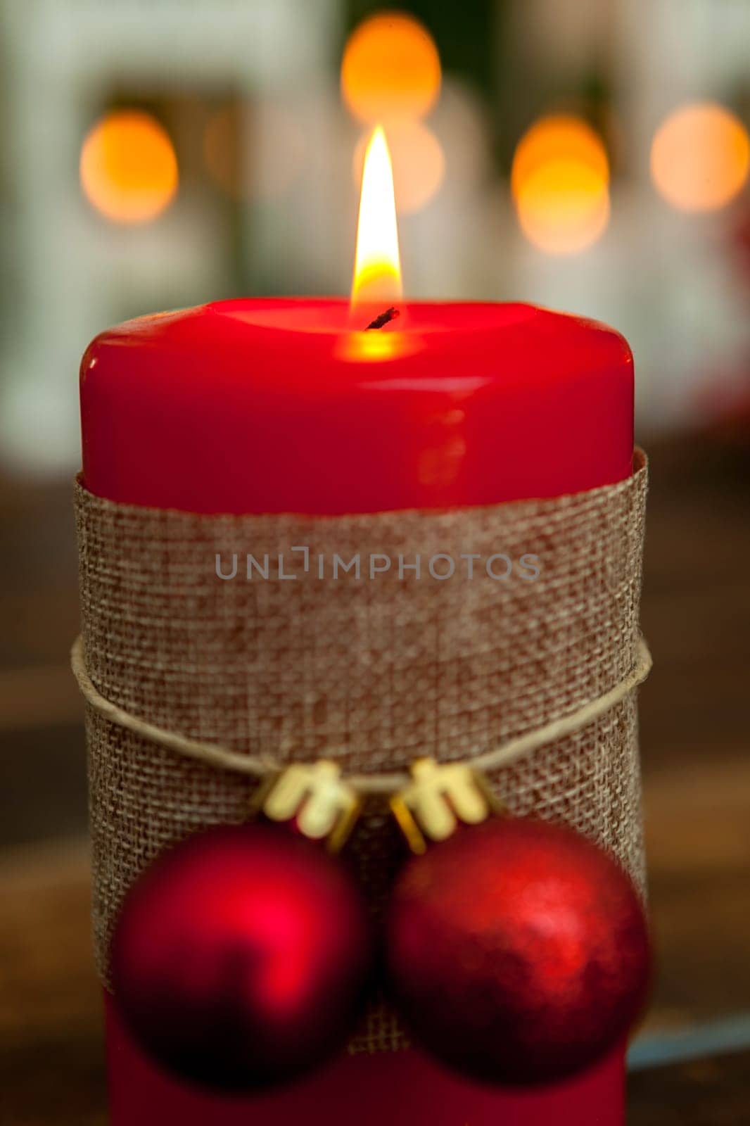 Candle for Christmas in red. Beautiful Holidays decoration