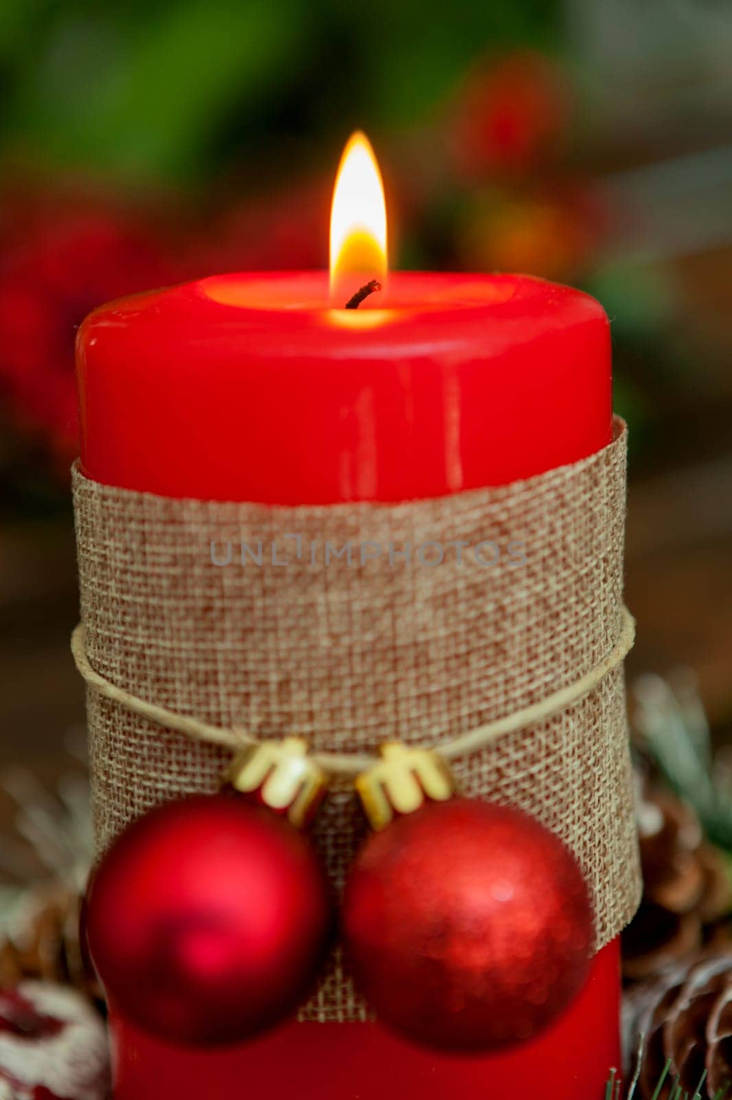 Candle for Christmas in red. Beautiful Holidays decoration