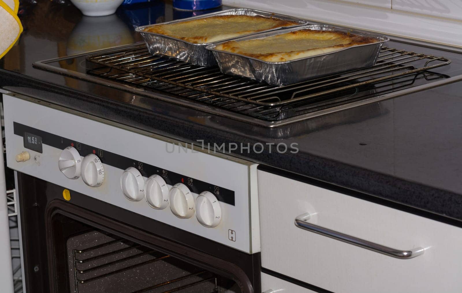 Tasty lasagne with meat covered with cheese served on white plate