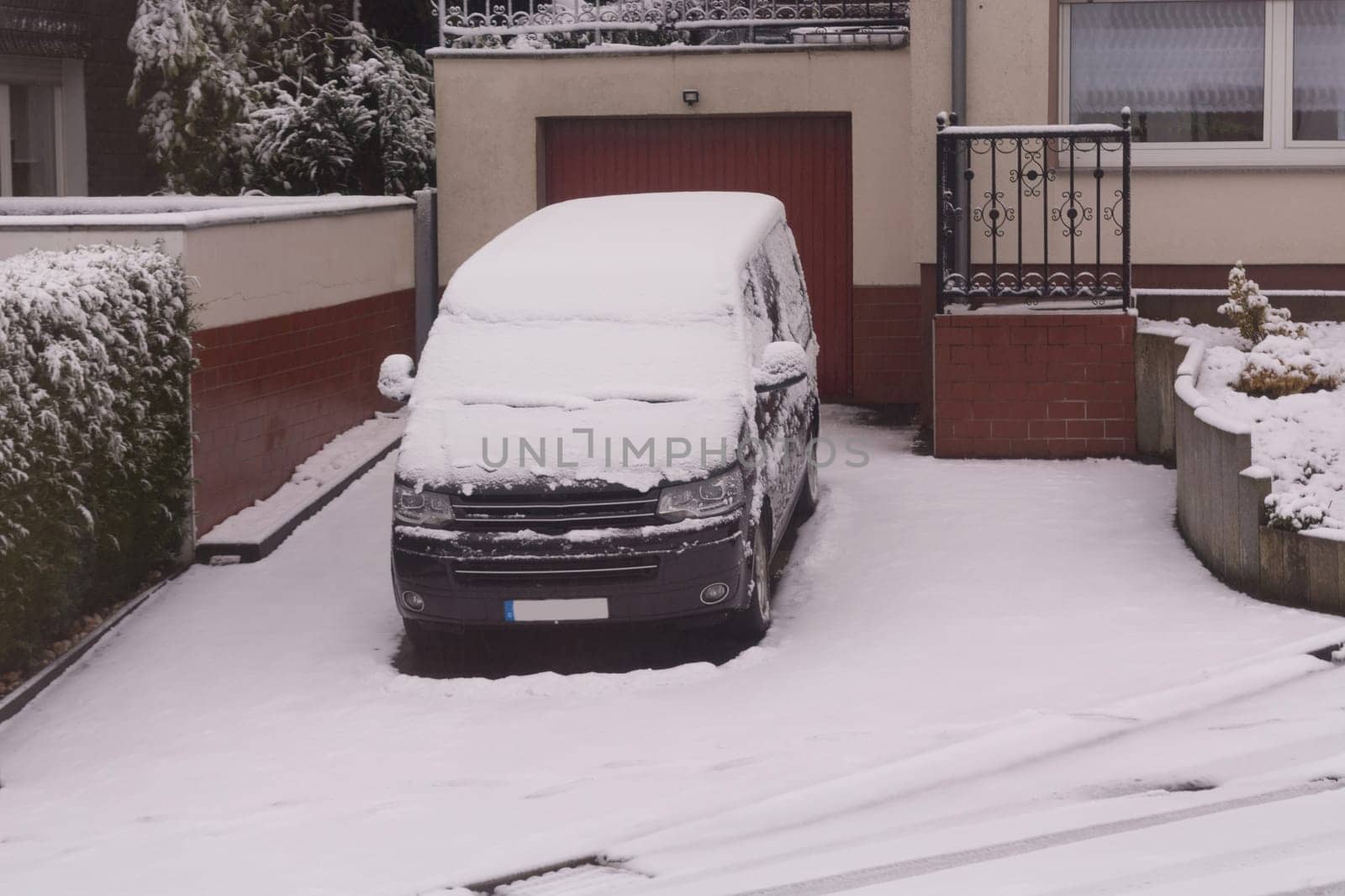 The car in the snow, covered with a white drift of snow.