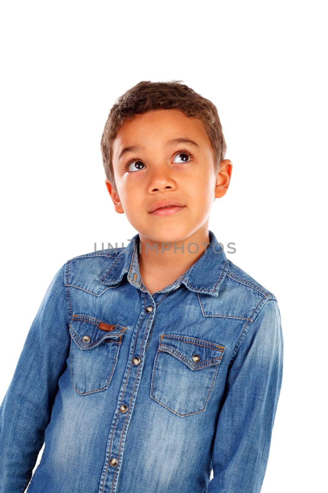 Funny small child with dark hair and black eyes crossing his arms isolated on a white background