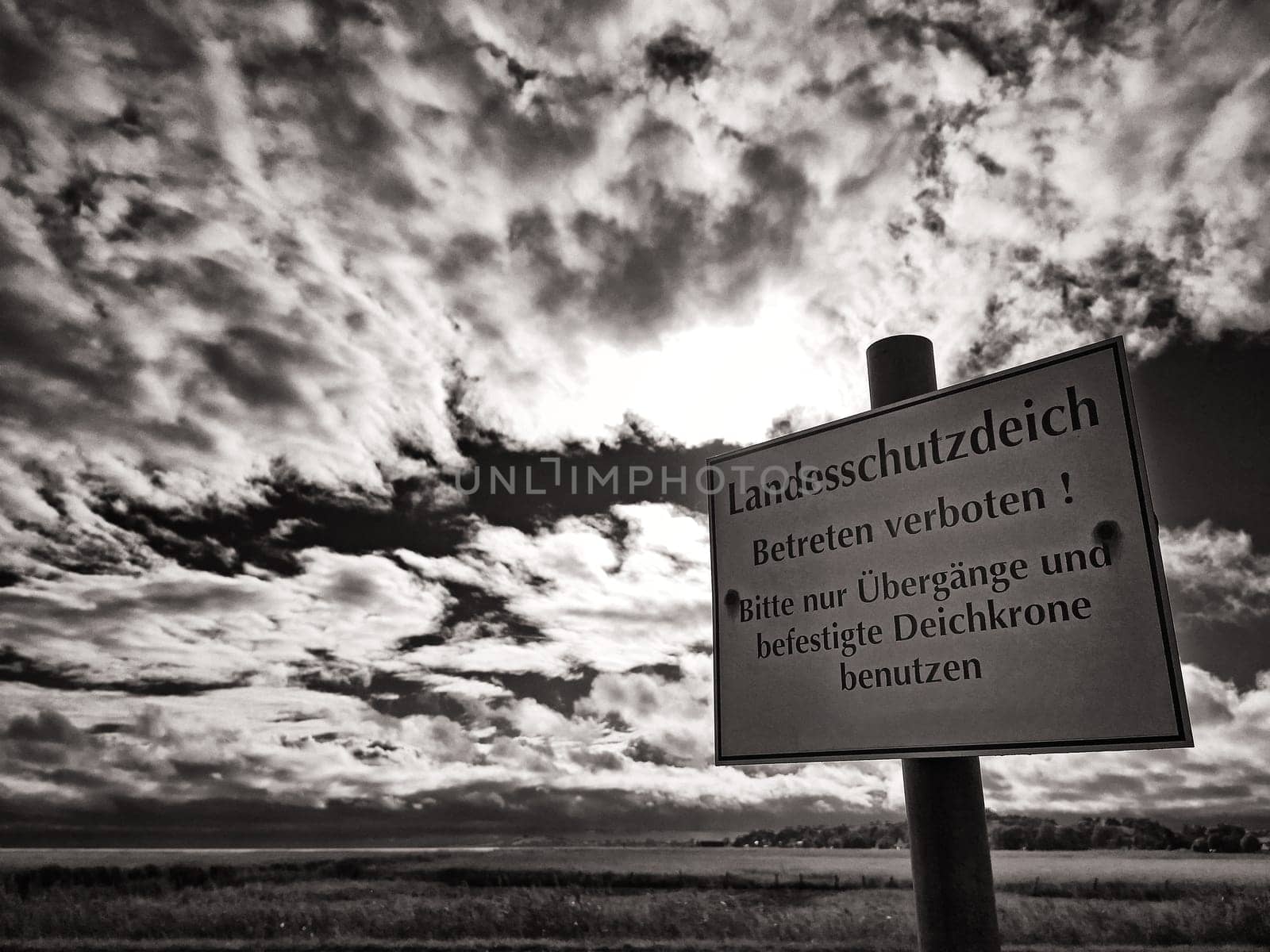 Warning sign on protective dike, Mecklenburg Baltic Sea coast