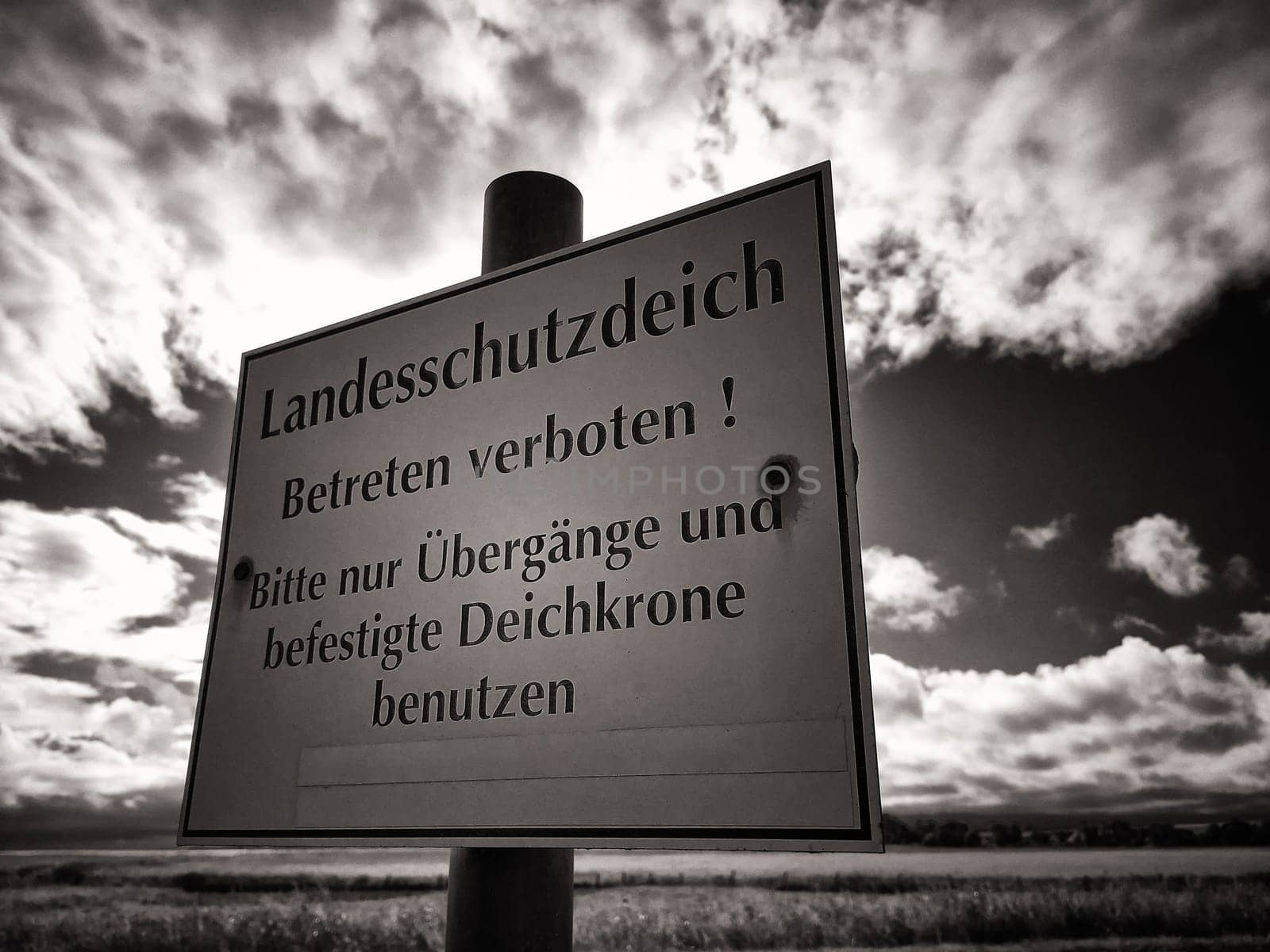 Warning sign on protective dike, Mecklenburg Baltic Sea coast