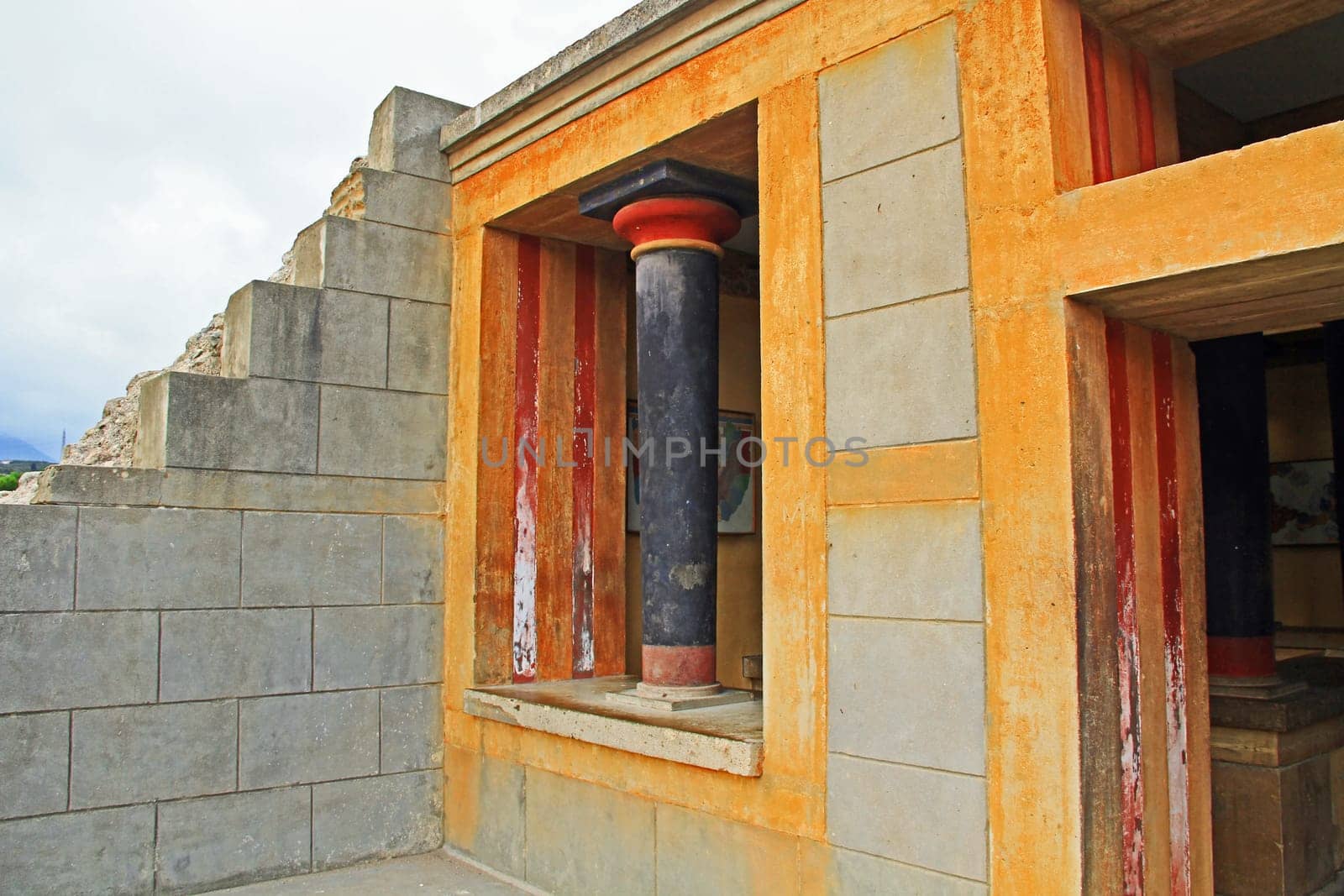 Orange window in The Palace of Knossos on Crete in Greece near Heraklion is called Europe’s oldest city and the ceremonial and political center of the Minoan civilization.