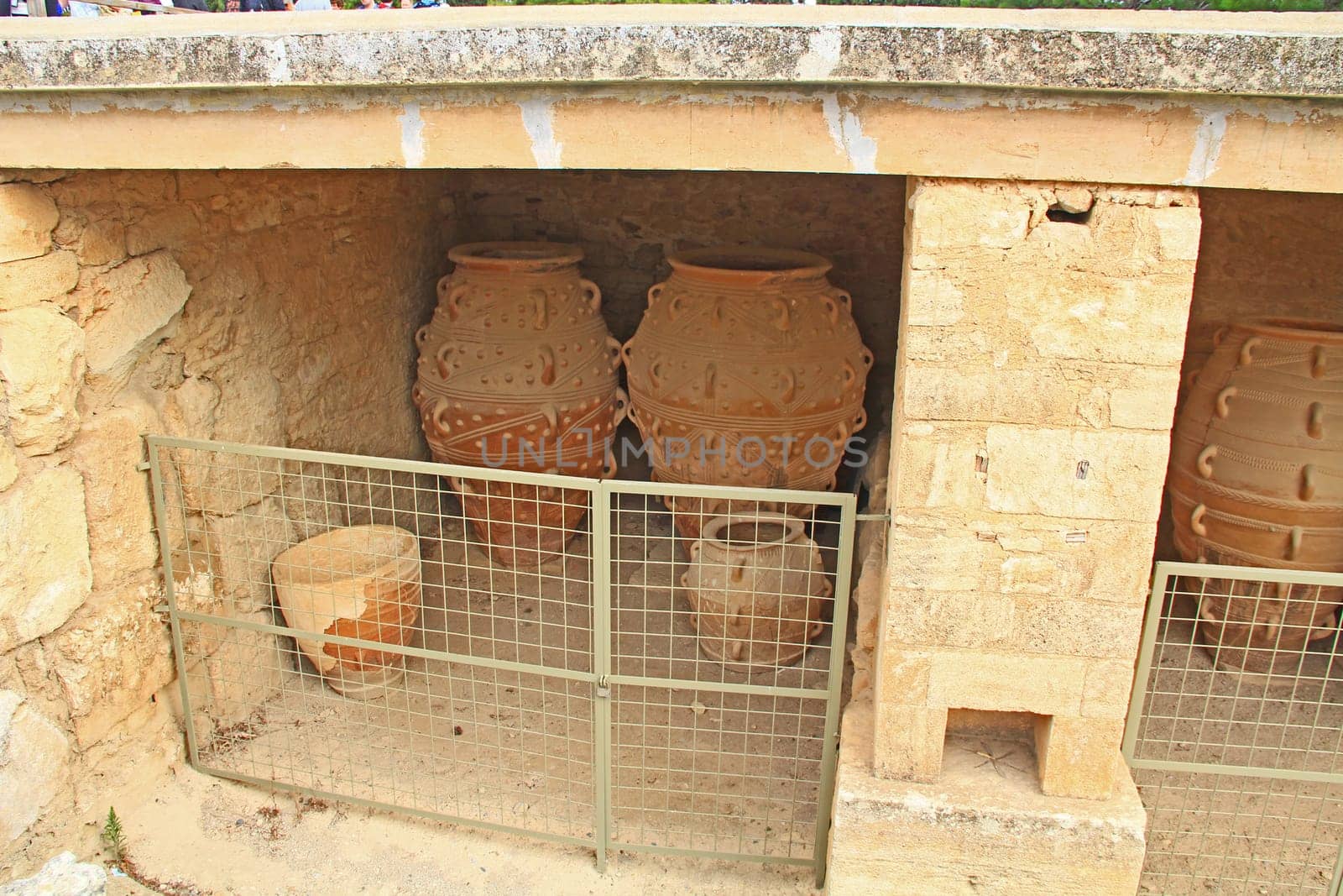 Clay jars or pithoi in the magazine of The Palace of Knossos on Crete in Greece near Heraklion is called Europe’s oldest city and the ceremonial and political center of the Minoan civilization.