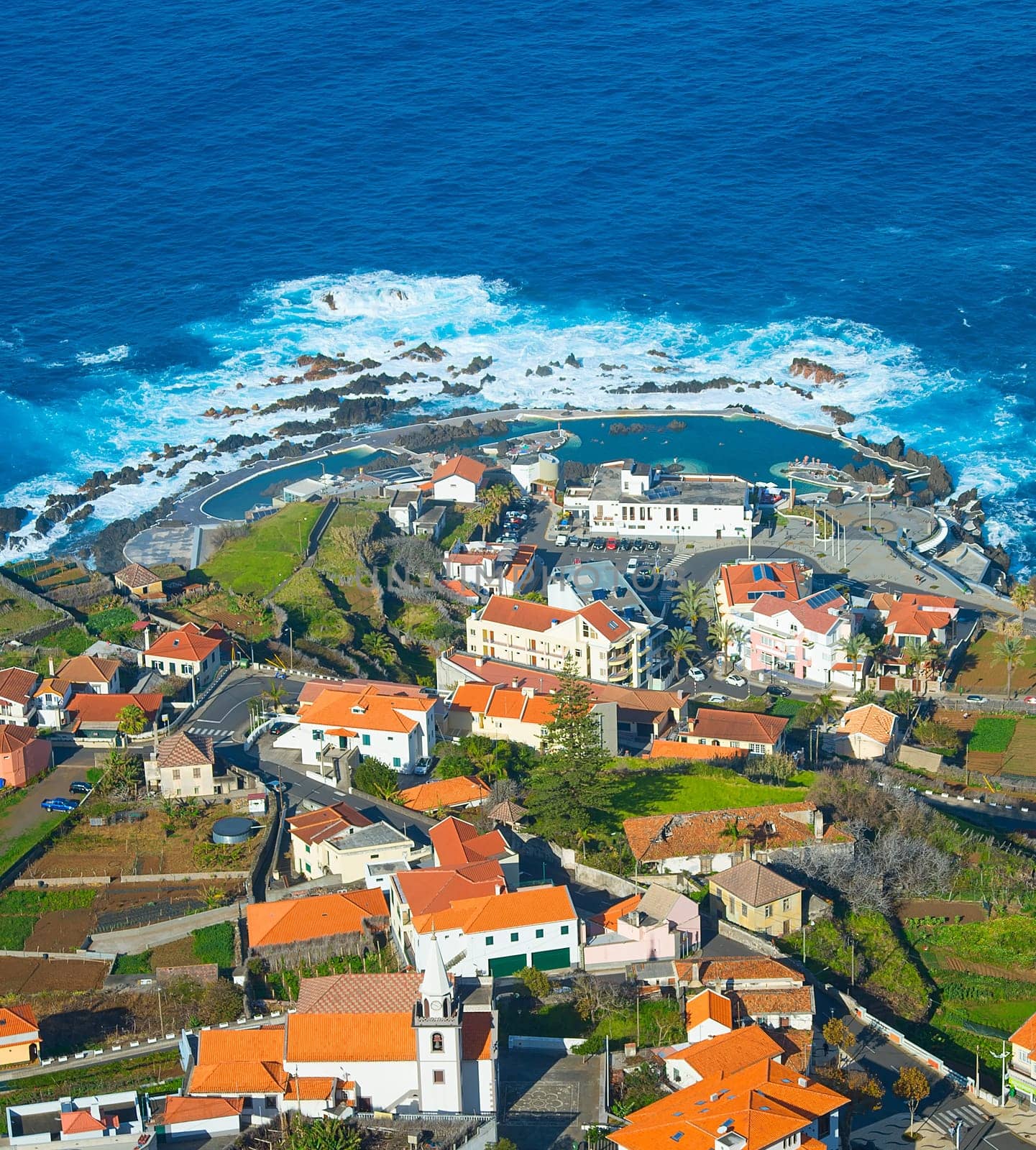 Aerial view of Porto Moniz town, famous for its natural volcanic lava pools. Madeira