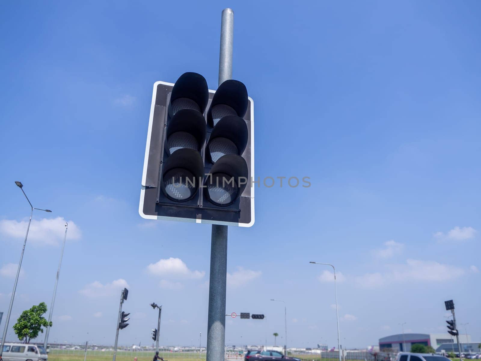 the traffic lights against a vibrant blue sky