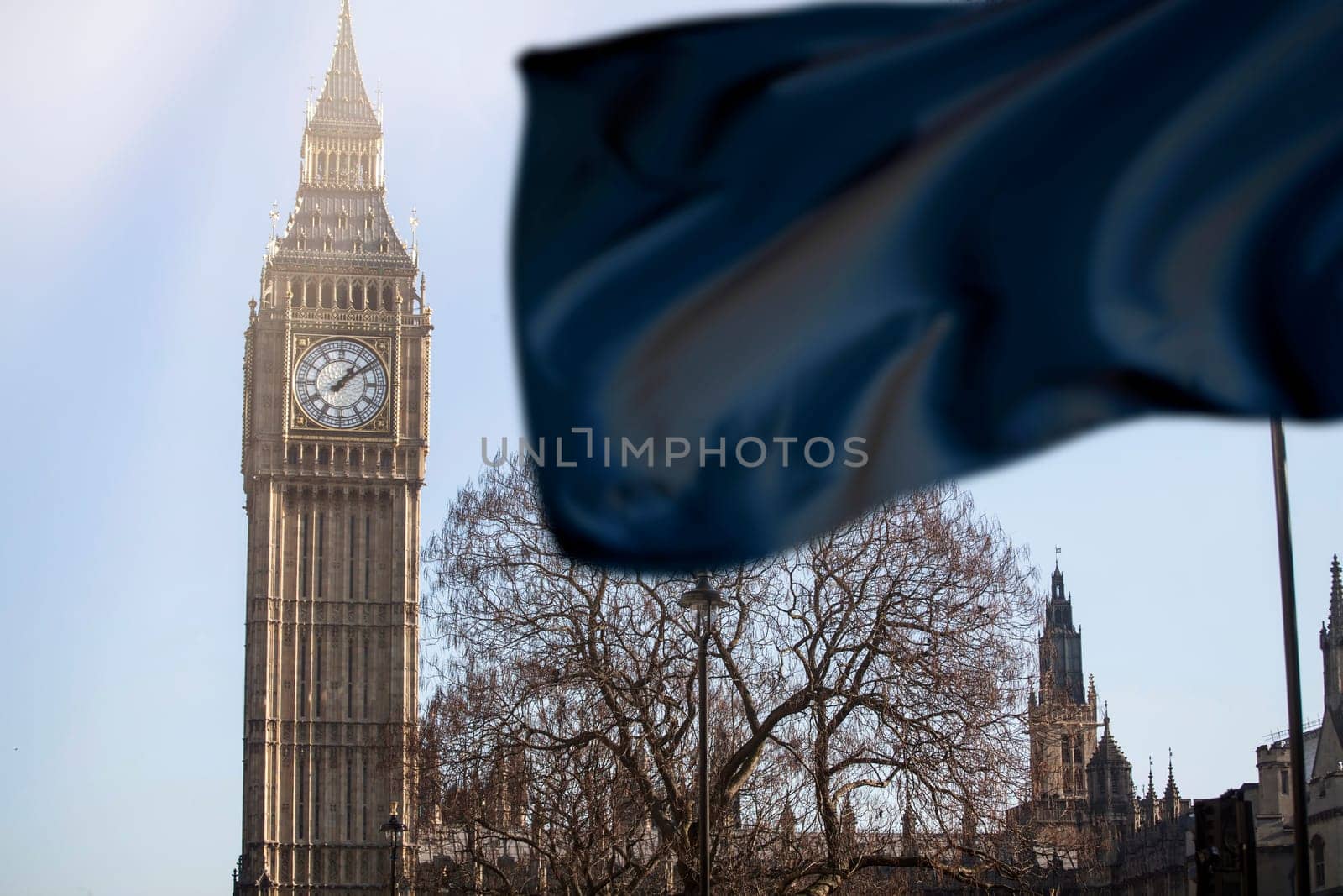 The clock face of Big Ben in Westminster with black flag. National mourning and sorrow concept.