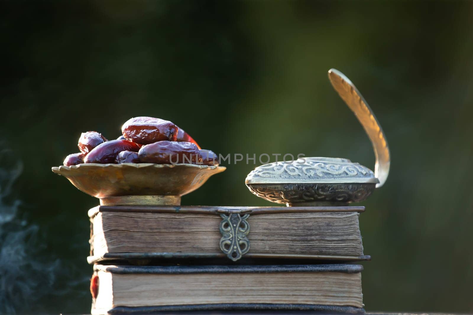 Festive greeting card for Muslim holy month Ramadan Kareem with dates, Quaran and censer