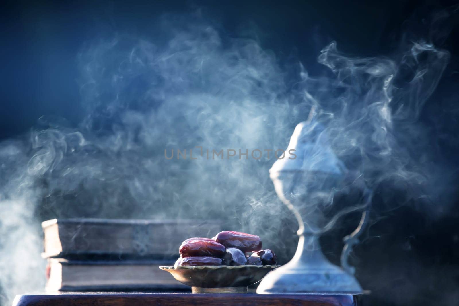Festive greeting card for Muslim holy month Ramadan Kareem with dates, Quaran and censer