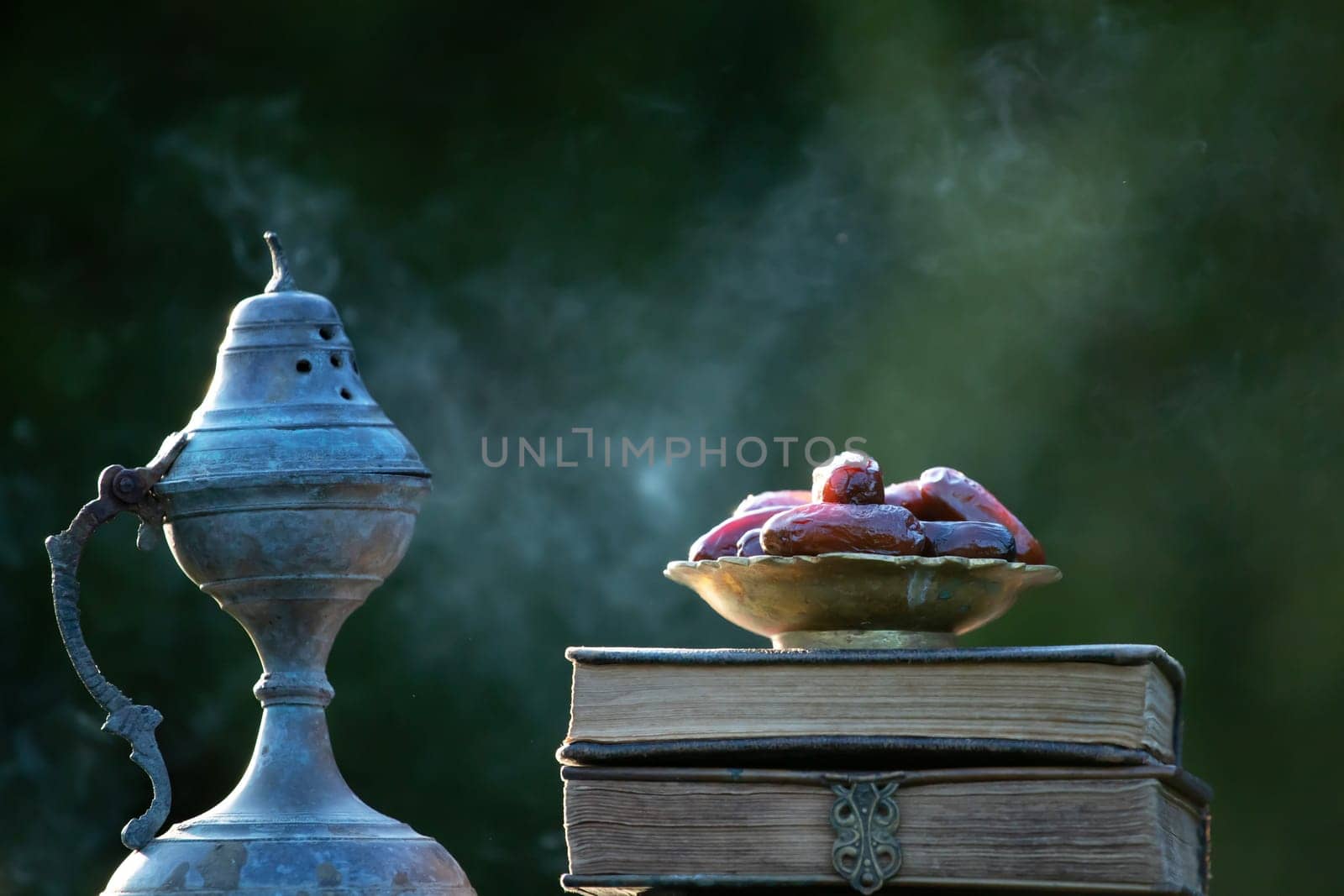 Festive greeting card for Muslim holy month Ramadan Kareem with dates, Quaran and censer