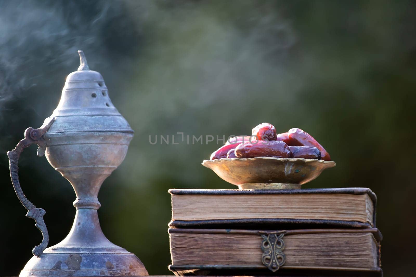Festive greeting card for Muslim holy month Ramadan Kareem with dates, Quaran and censer