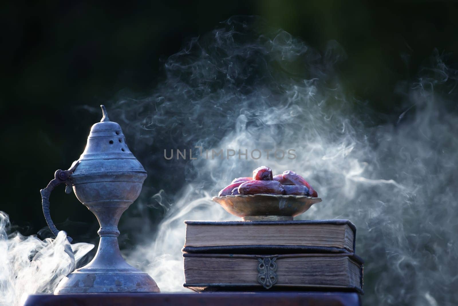 Festive greeting card for Muslim holy month Ramadan Kareem with dates, Quaran and censer