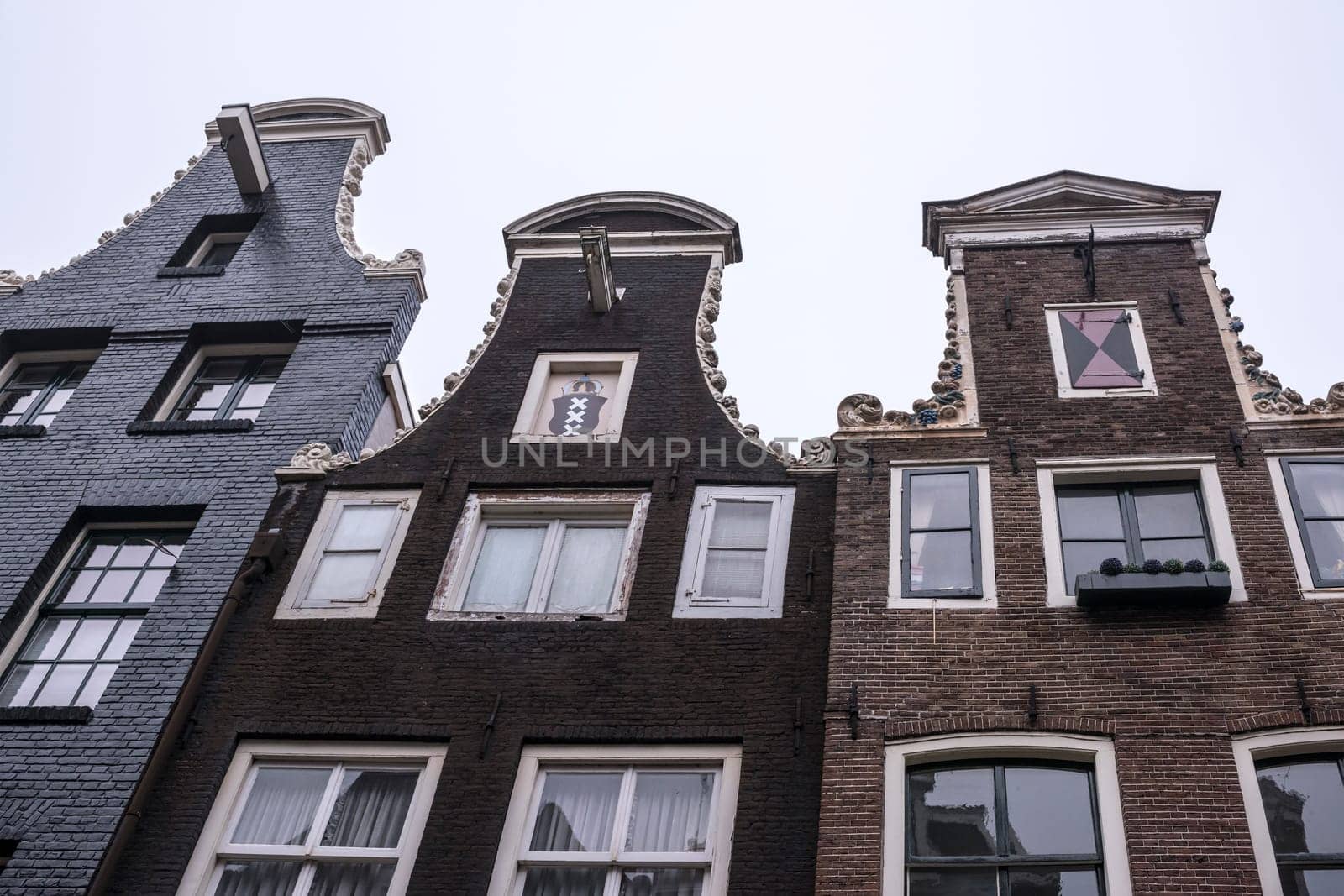 Amsterdam,Netherlands-December 30,2016:The upper parts of buildings, visible console for lifting