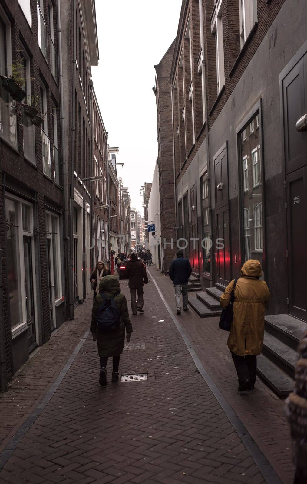 Amsterdam,the Netherlands-December 30,2016:On the street walking people and moving vehicles