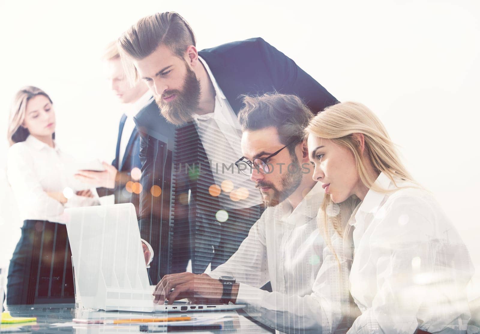 Businessman in office connected on internet network with a computer. concept of startup company. double exposure