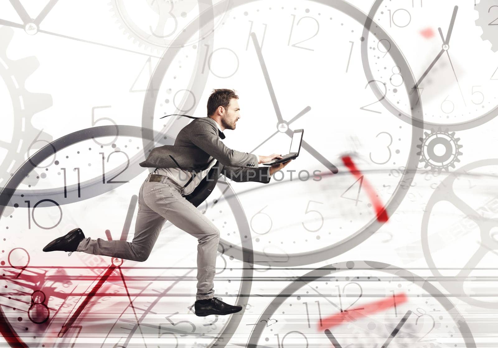 Business man runs fast with a laptop on a background of clocks