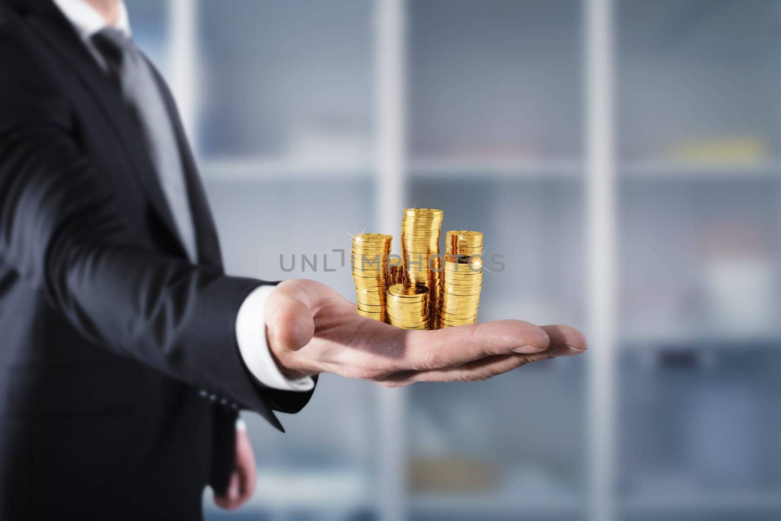 Businessman hold piles of gold money Concept of success and company growth