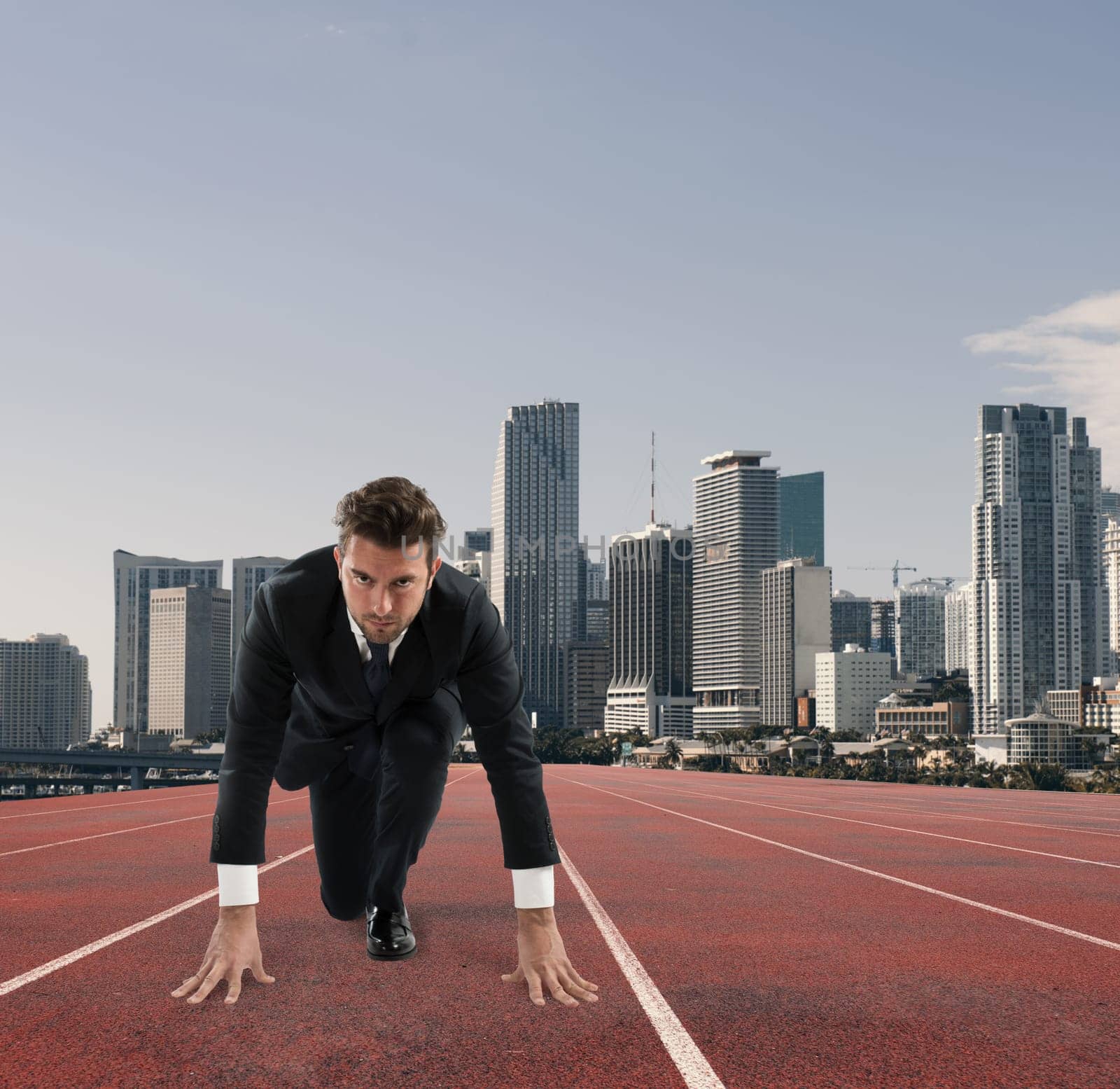 Businessman acts like a runner on a track. Competition and challenge in business concept