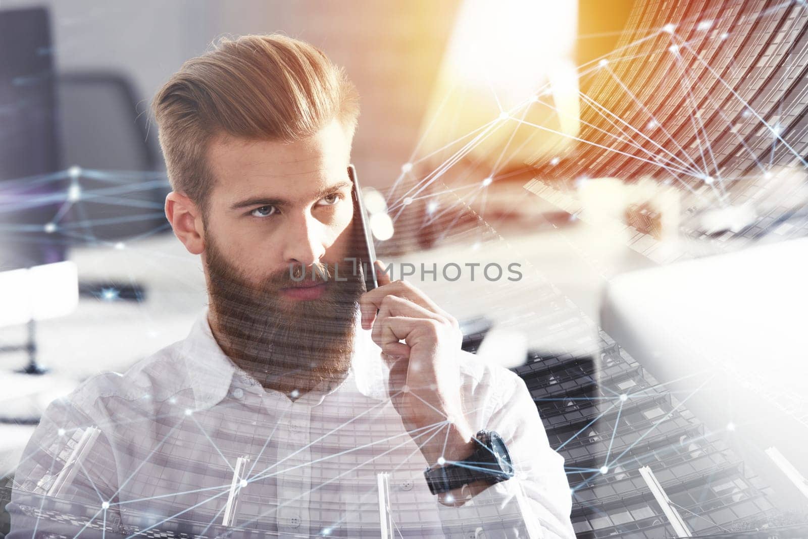 Double exposure of a businessman in a modern office talking to the mobile phone with internet network effects. double exposure