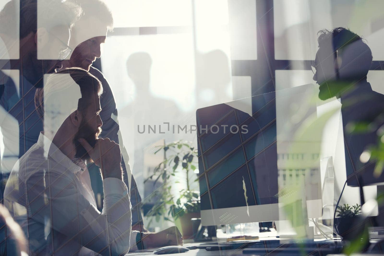 Business people in office connected on internet network with a computer. concept of startup company. double exposure