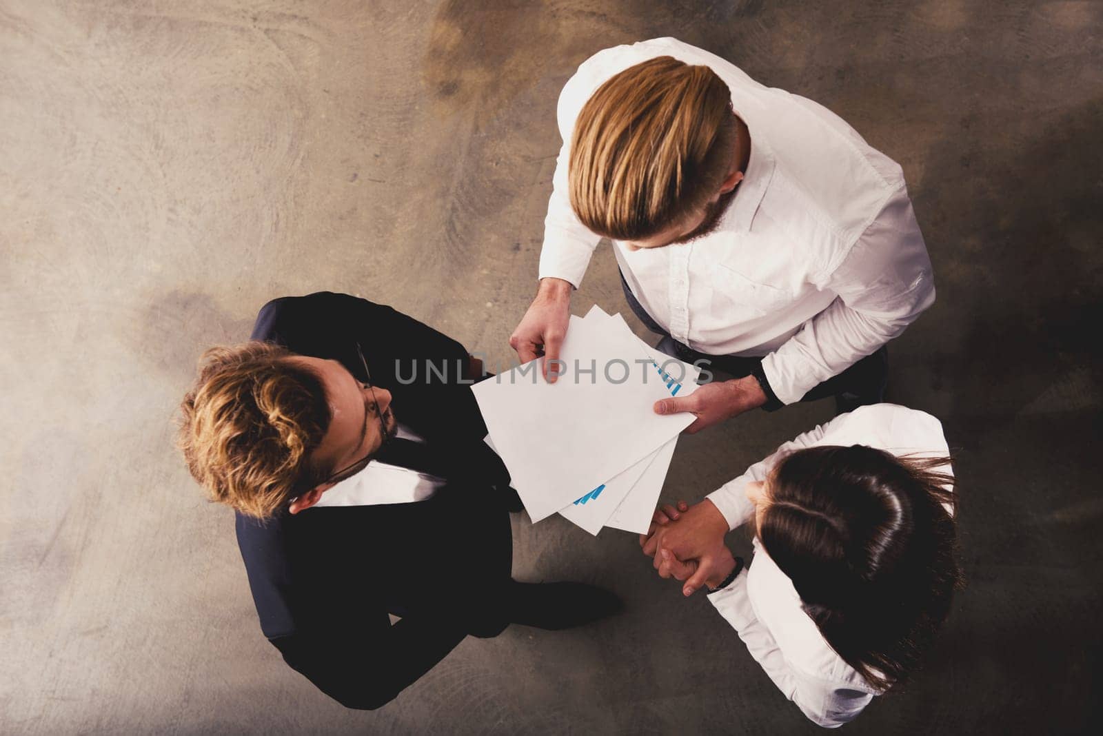 Team of people work together in office about company statistics. Concept of teamwork and partnership