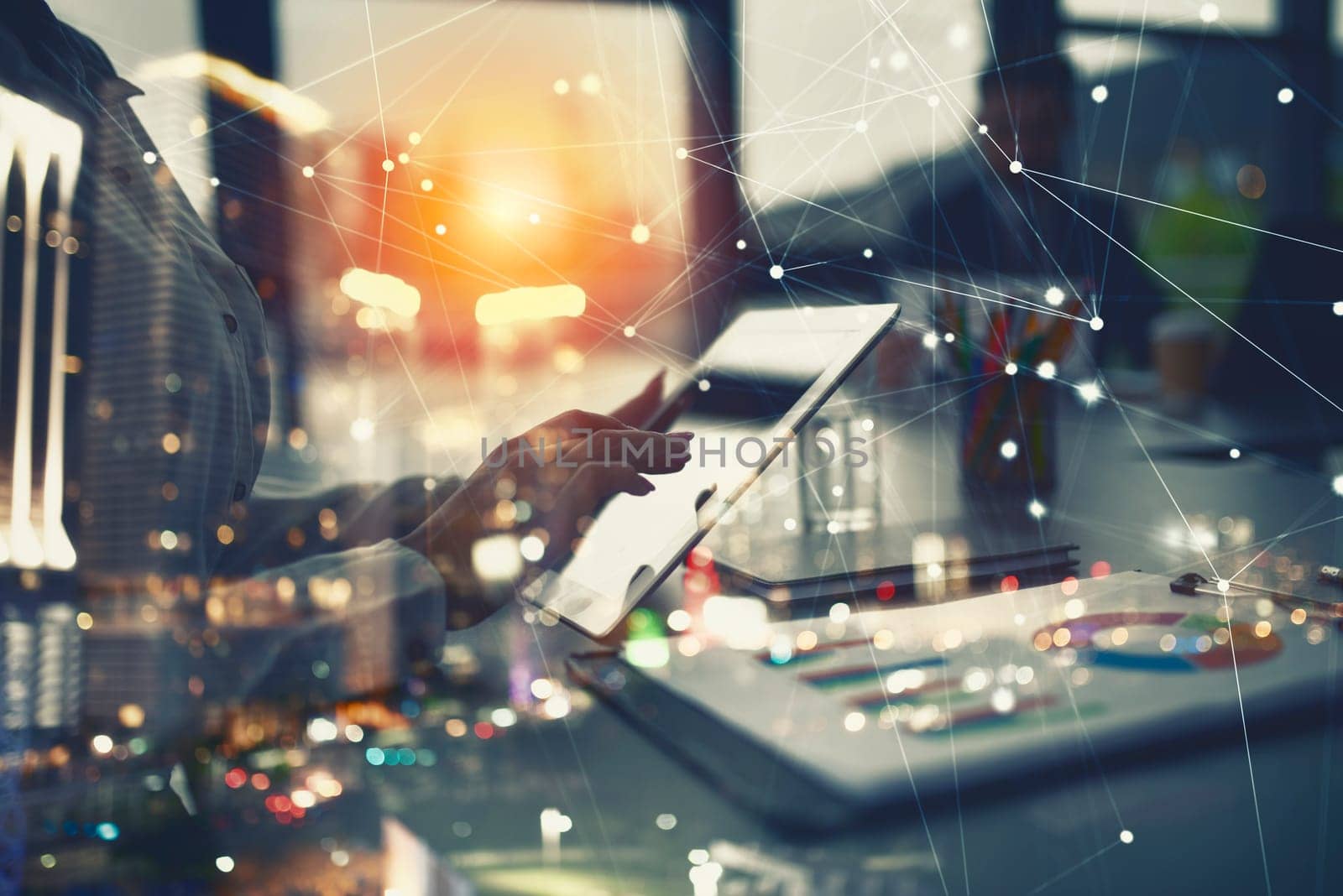 Businesswoman works in office with a tablet during a meeting. Concept of internet sharing and company startup. double exposure