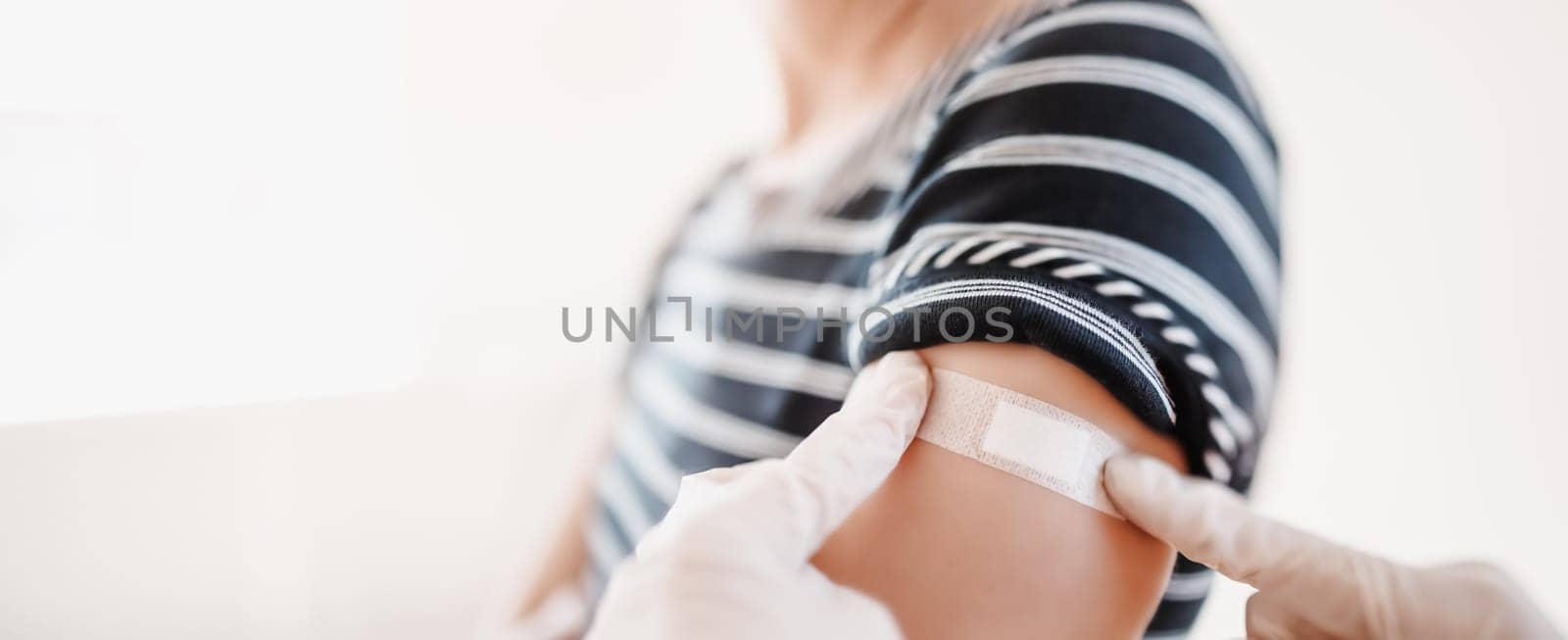 Woman and a doctor in the hospital after vaccination against Covid 19. Concept immunization and making injections from pandemic of SARS.