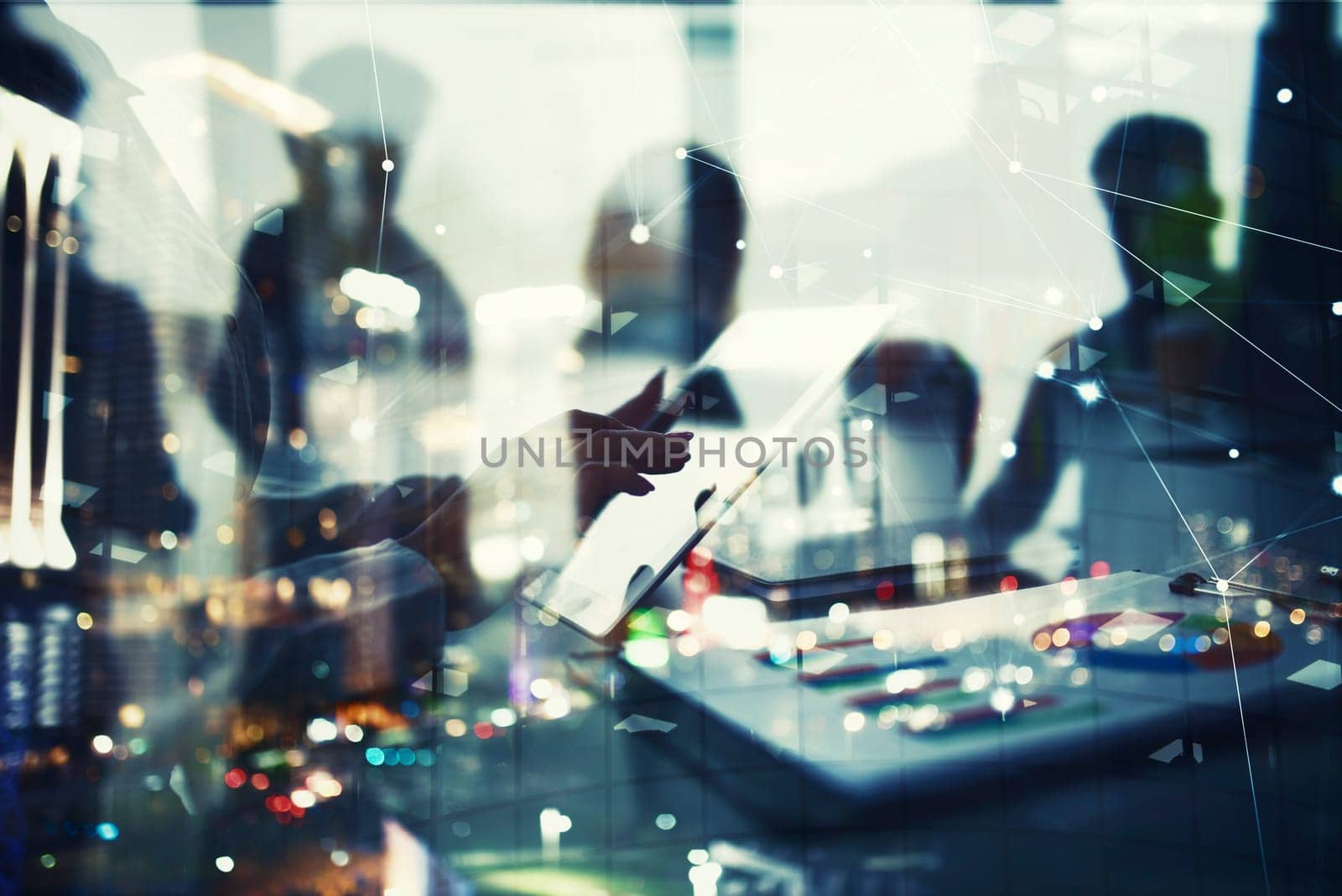 Businesswoman works in office with a tablet during a meeting. Concept of internet sharing and company startup. double exposure