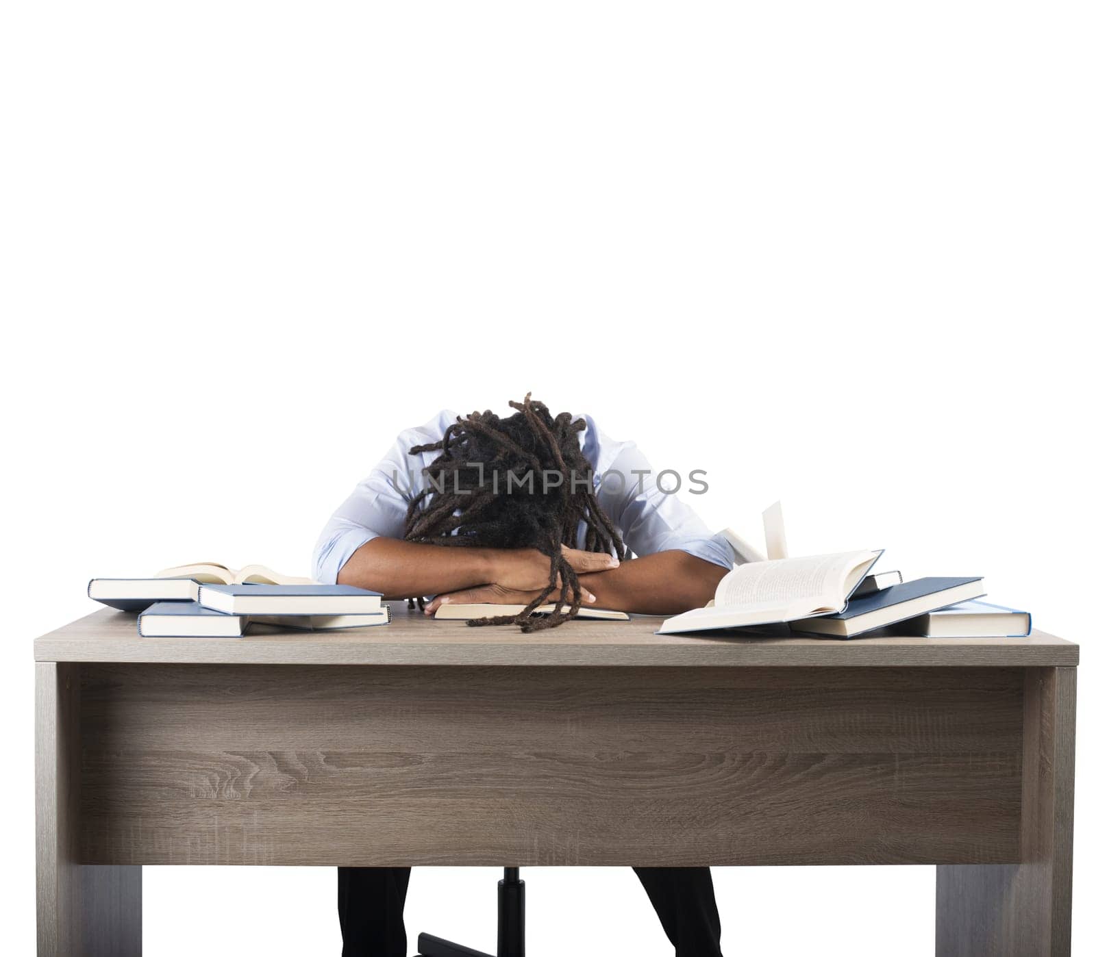 Man tired of studying sleeping over books