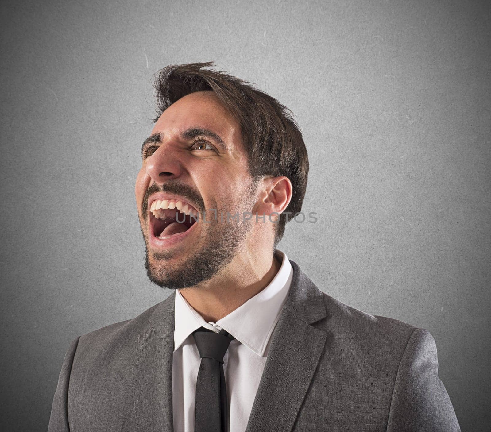 Desperate businessman stressed out from work screams