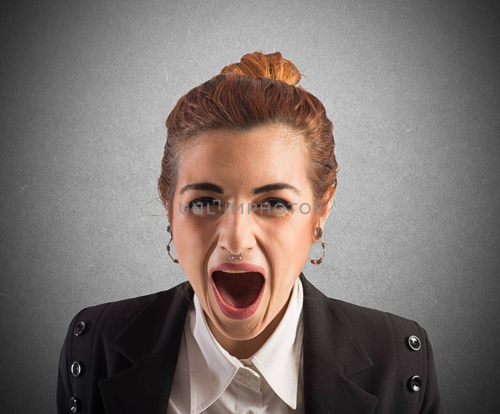 Businesswoman stressed and frustrated screams at work