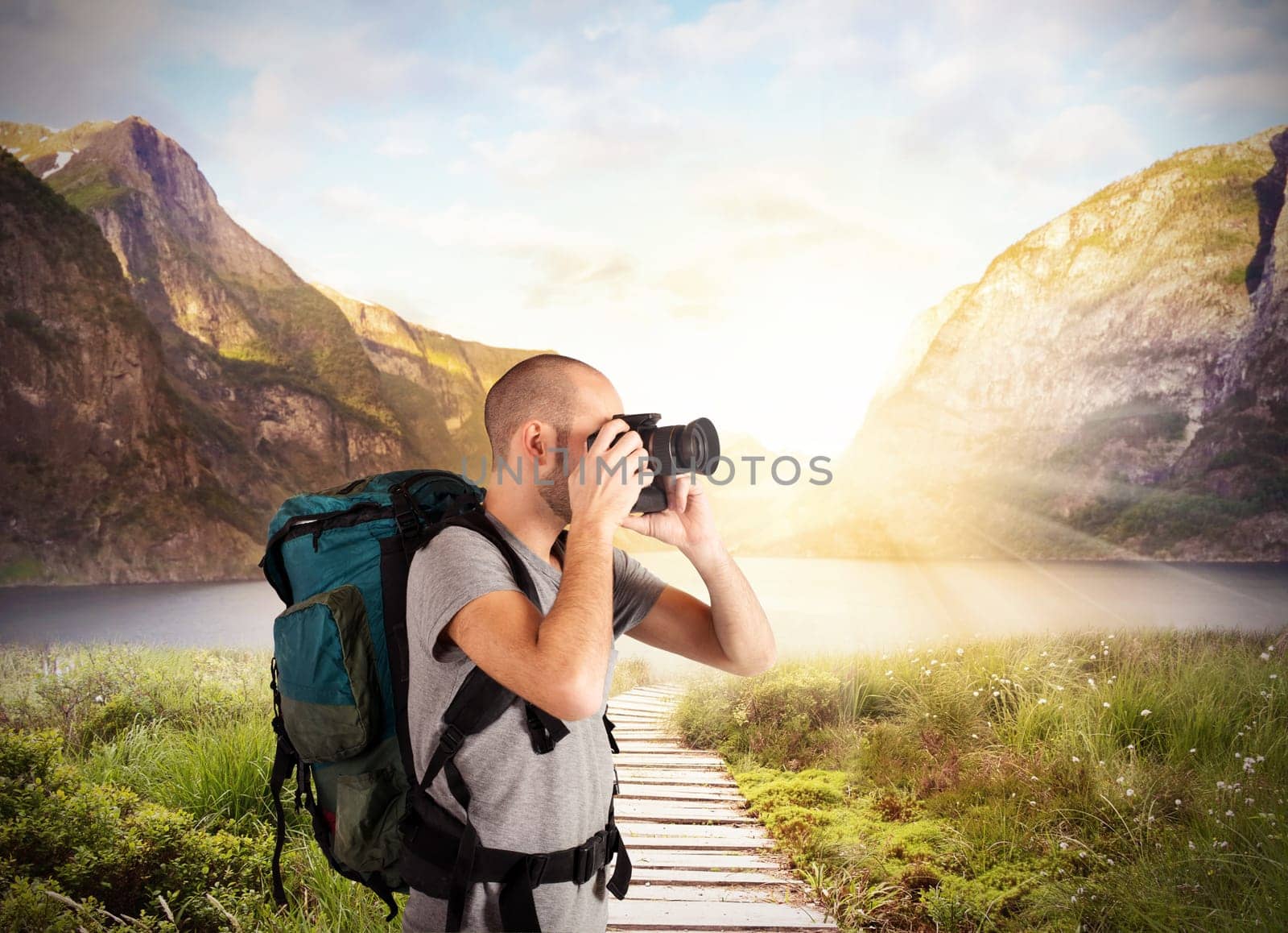 Explorer takes pictures in a natural landscape