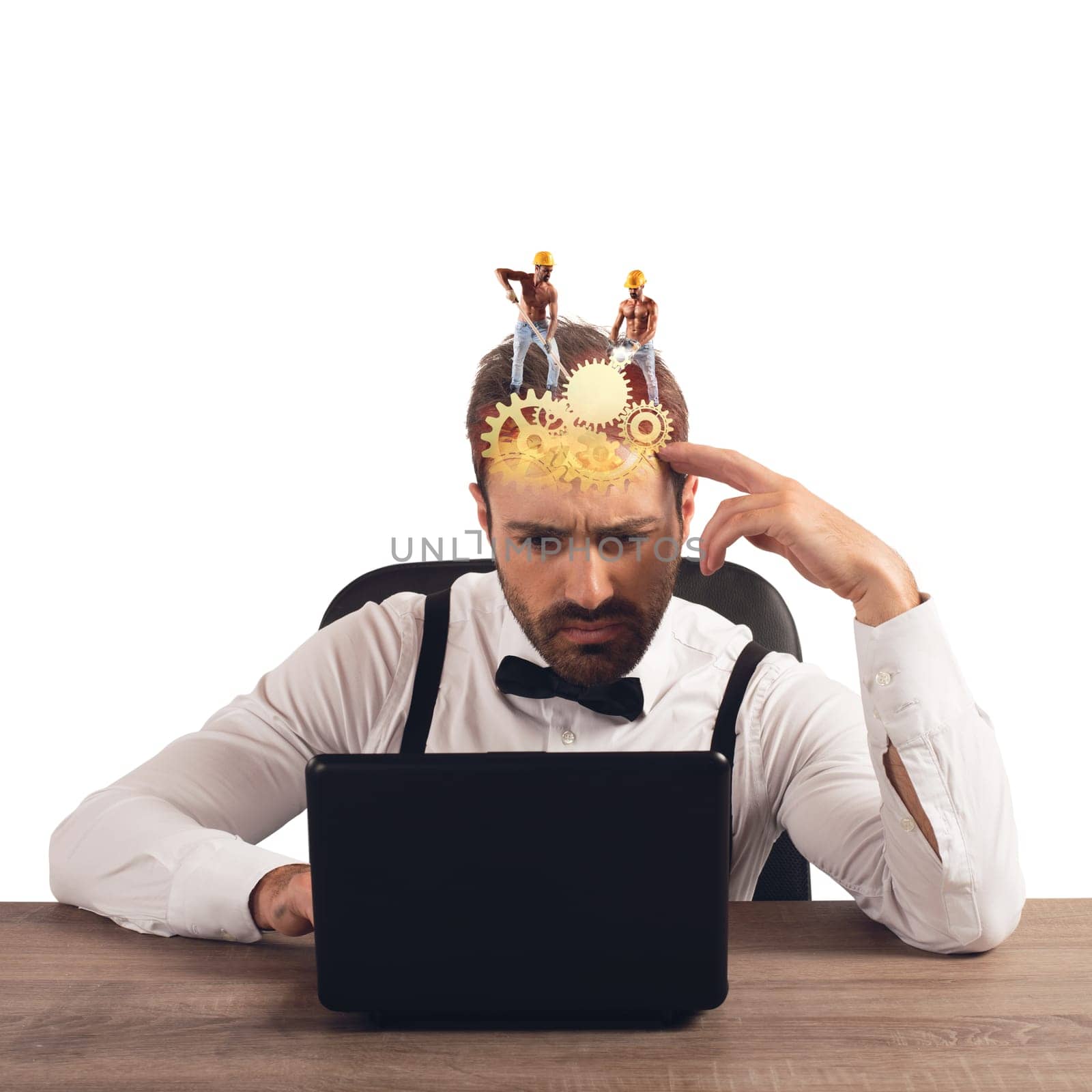 Thoughtful businessman at computer designing an idea