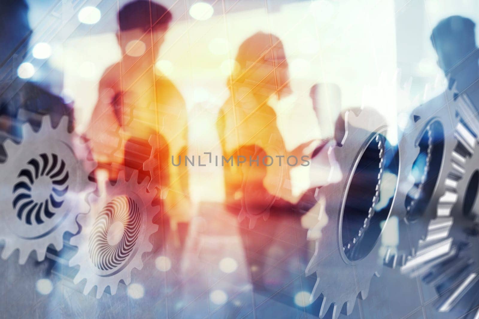 Business people work together in office with gears system on overlay. Concept of integration, teamwork and partnership. double exposure