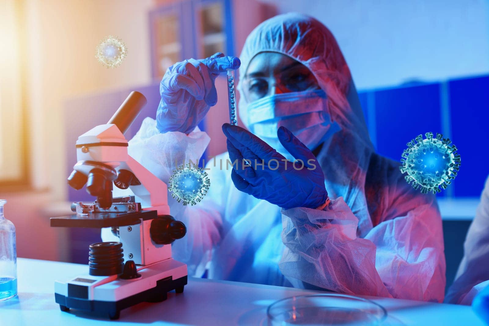 Researcher studies new treatments under the microscope