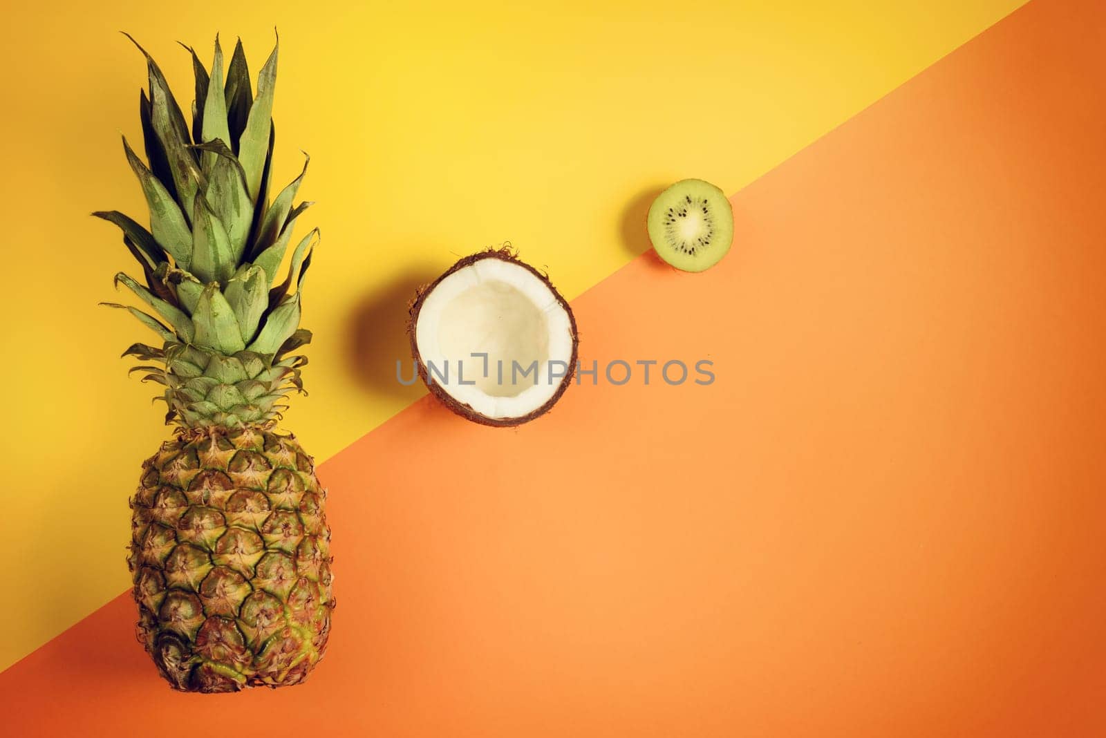 Colorful composition of pineapple, coconut an kiwi