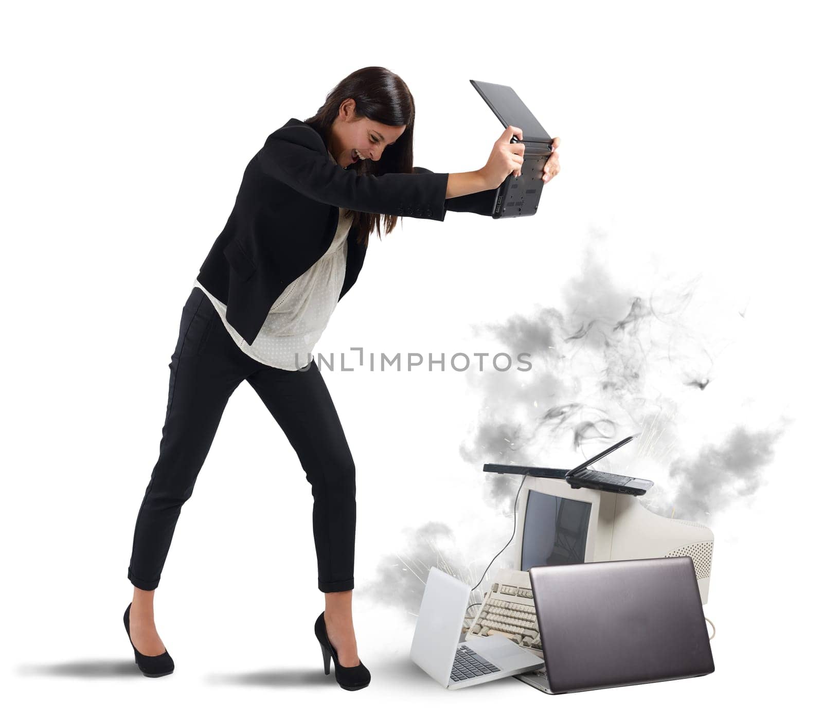 Stressed businesswoman furiously attacking computers and laptops
