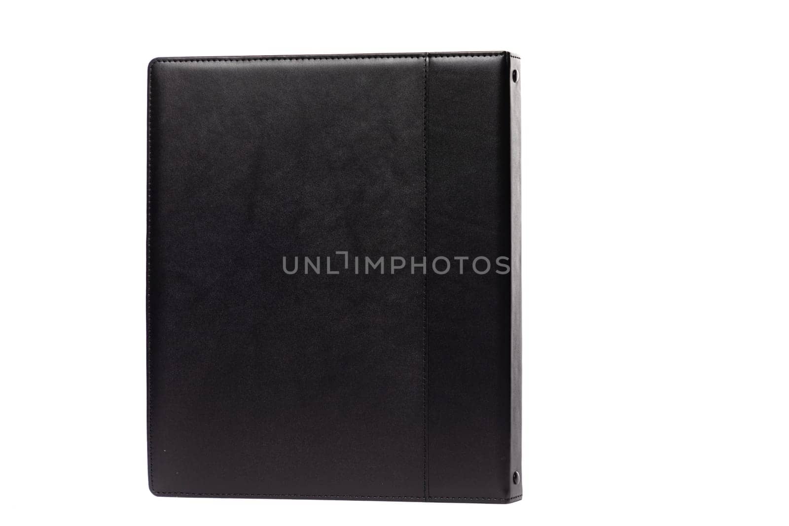 This black leather binder stands upright, featuring a smooth texture and simple design that enhances organization for documents and notes. Perfect for business or personal use.