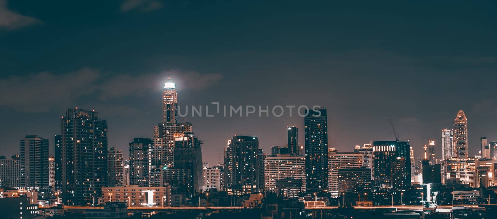 Bangkok, Thailand - 14 Juny 2019: Panoramic landscape scenery of buildings and skycrapers in the central business area of Bangkok city at night