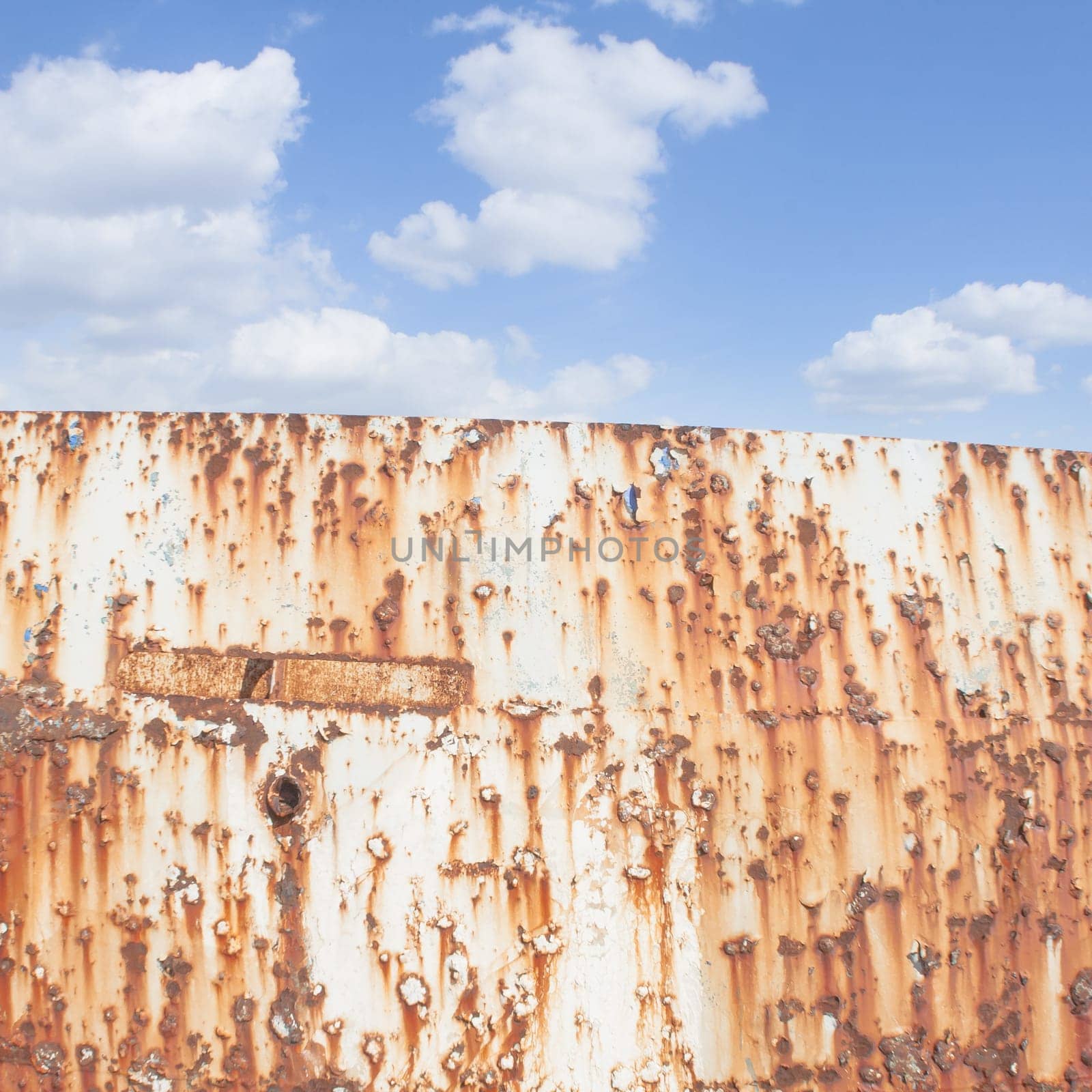Blue Sky and rust. Rusted shipwreck and blue sky in background.