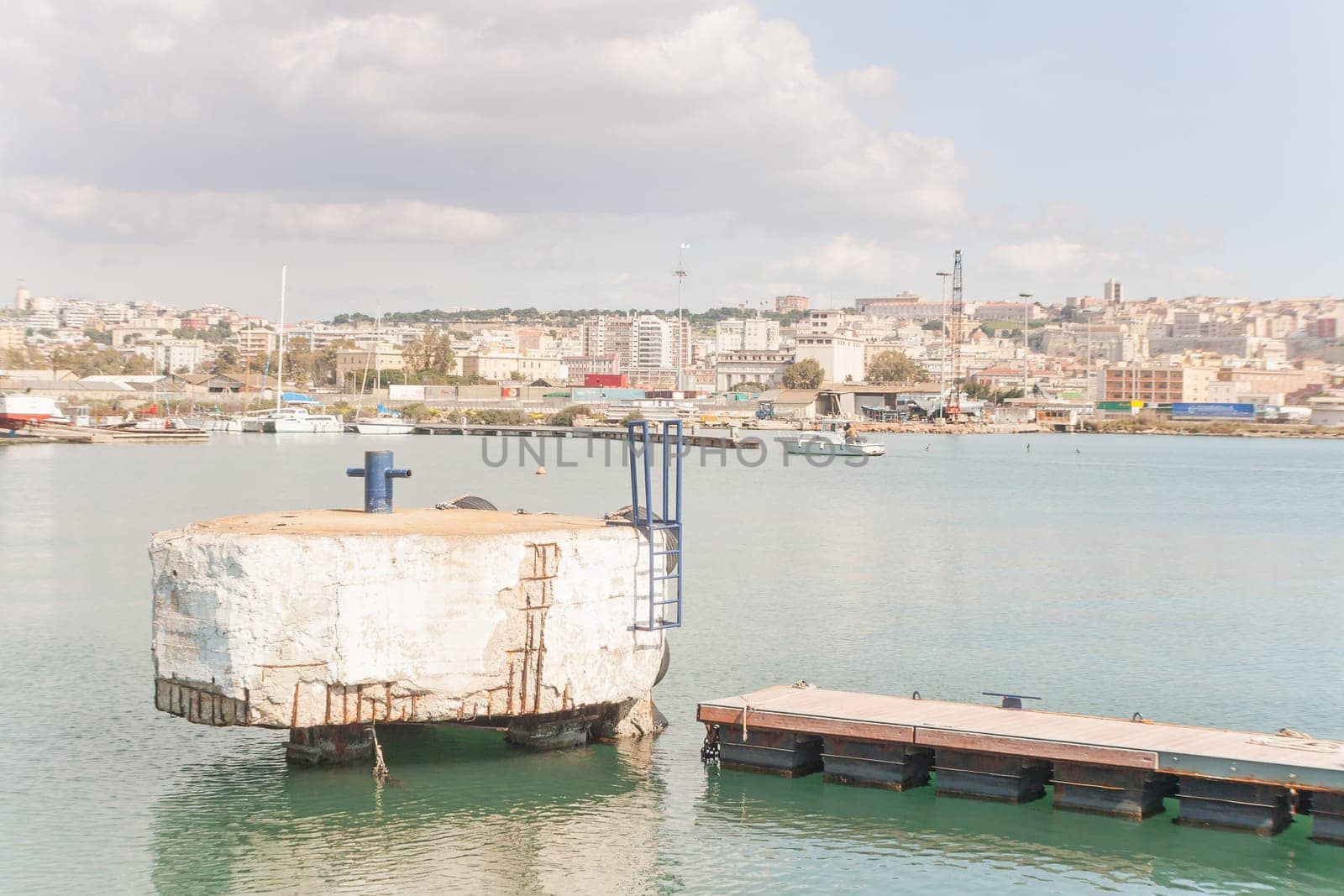 Landing at the pier in Cagliari harbor .
