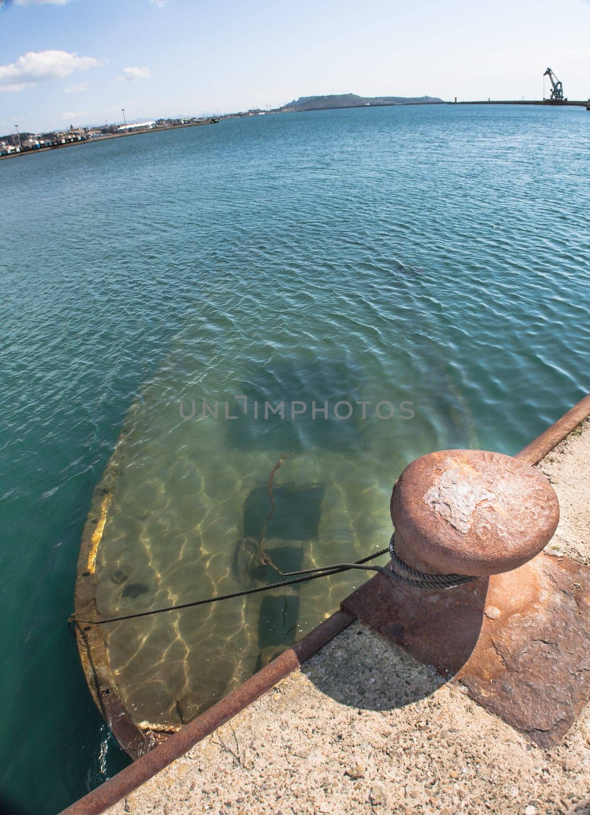 Shipwreck at the pier. harbor of Cagliari - Sardinia.