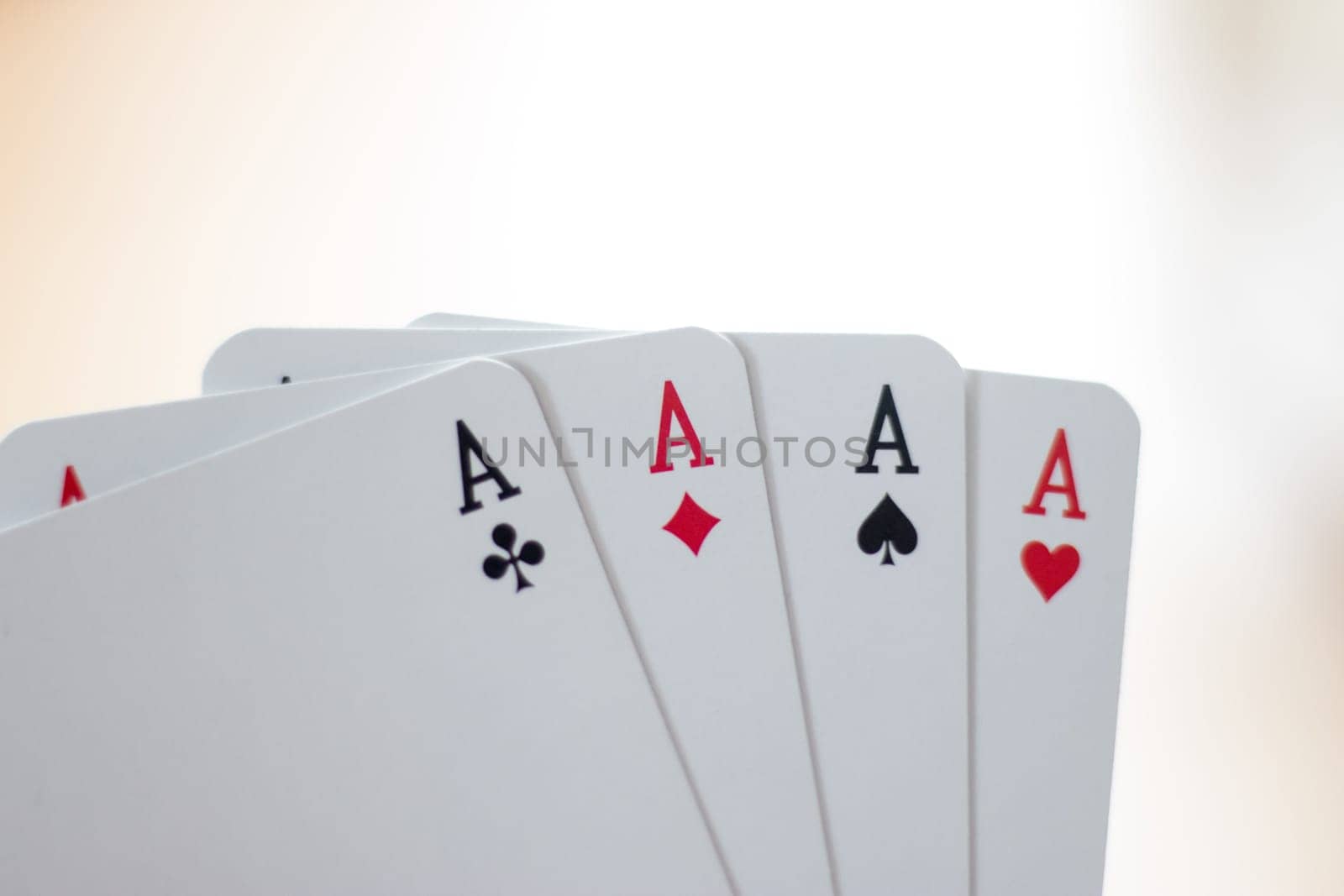 Young man is playing cards, cutout of his hands